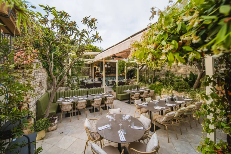 Elegant outdoor dining area surrounded by trees at Paradise Garden Hvar